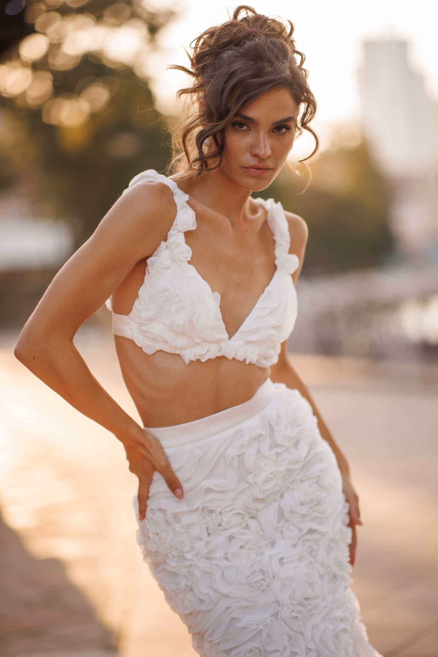 Mermaid wedding dress with boat neckline and ruffled fishtail train
