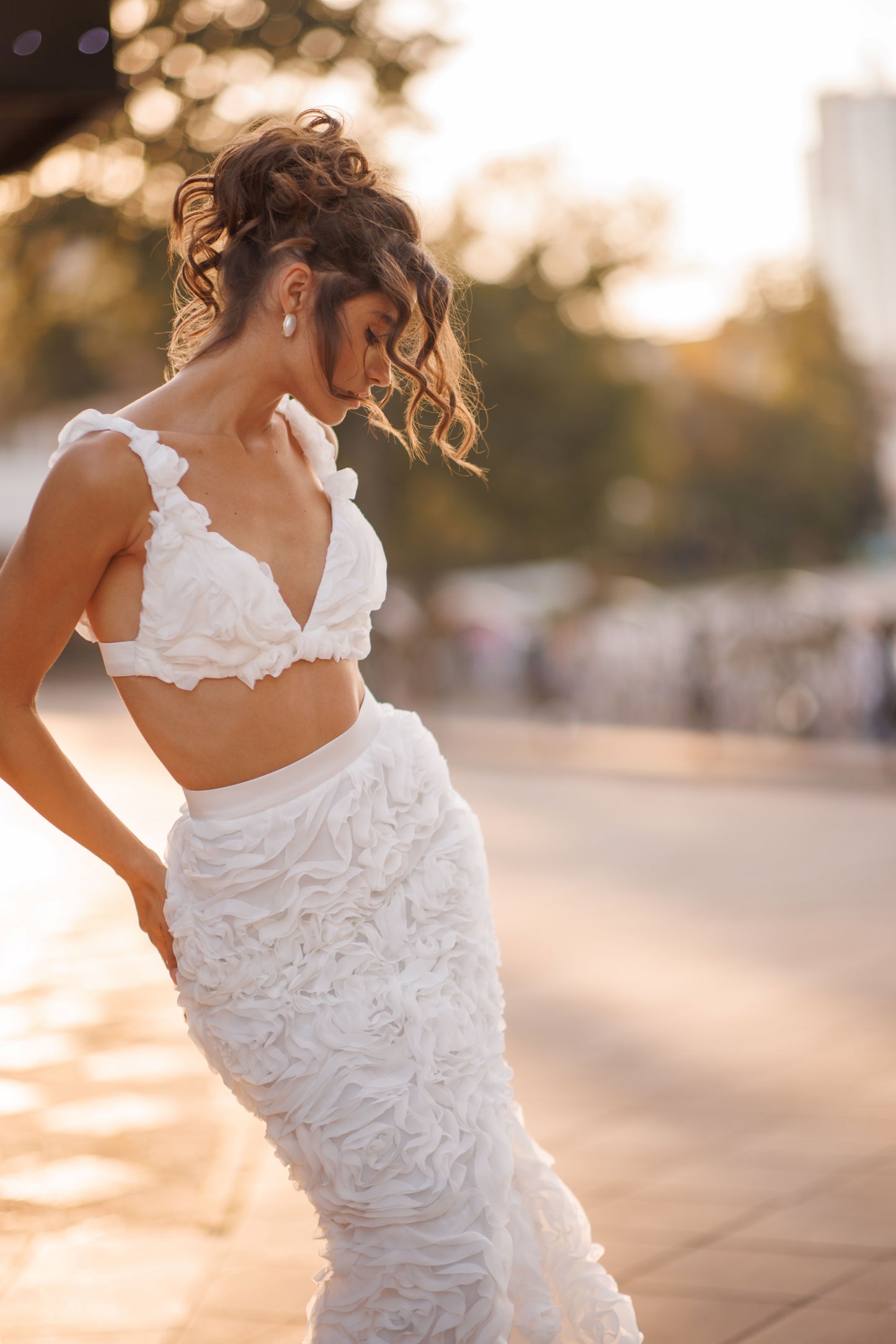 Mermaid wedding dress with boat neckline and ruffled fishtail train