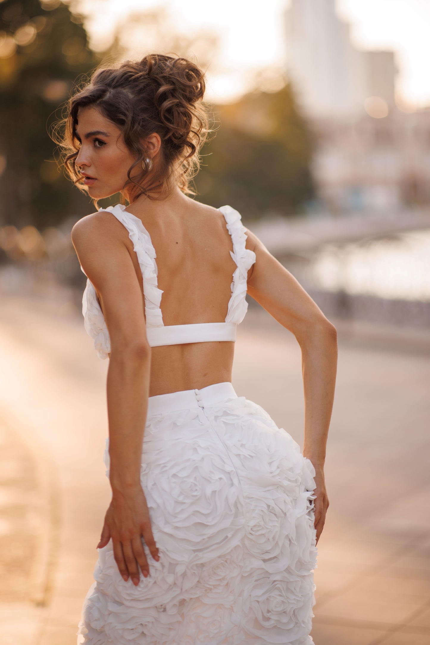 Mermaid wedding dress with boat neckline and ruffled fishtail train