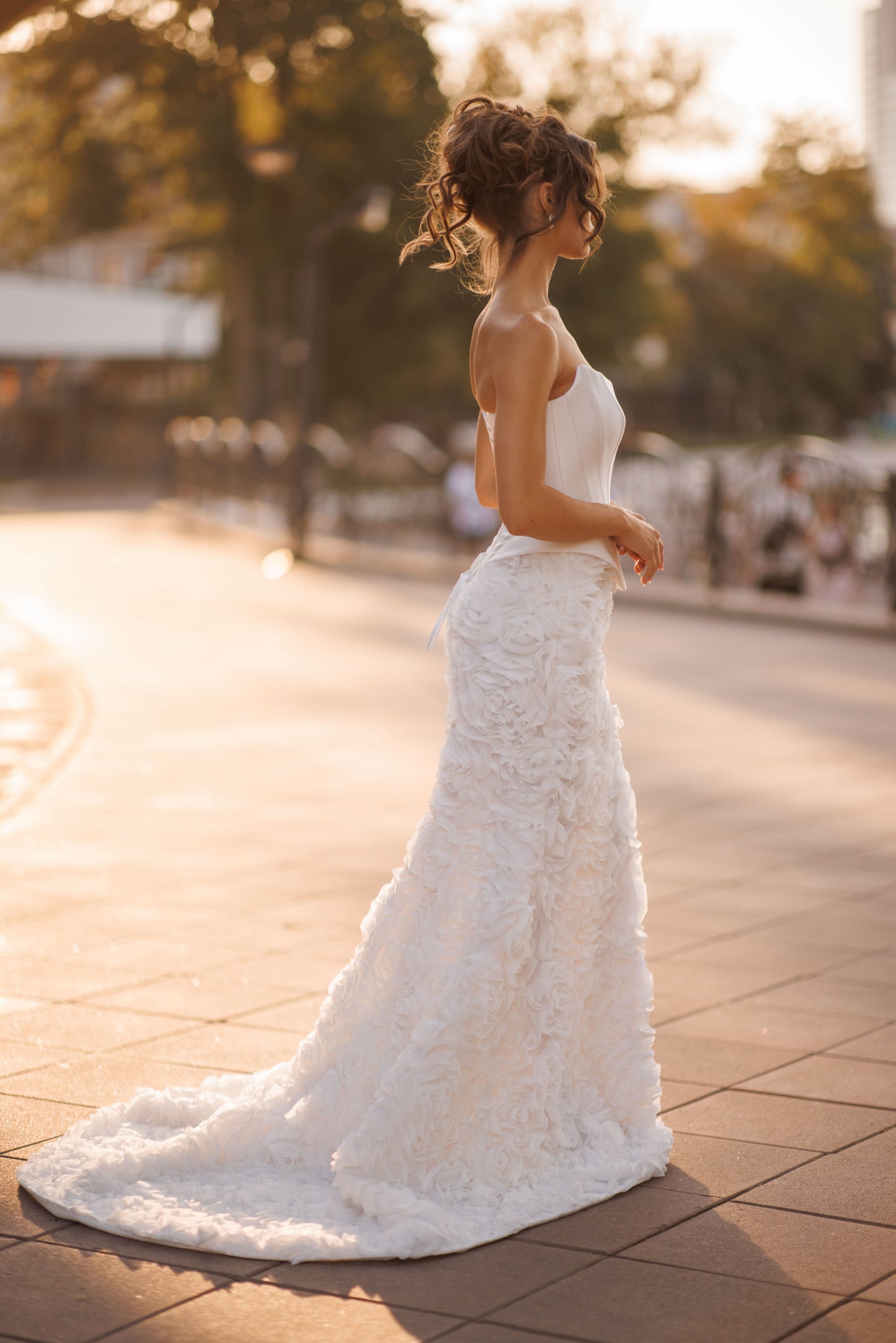 Mermaid wedding dress with boat neckline and ruffled fishtail train