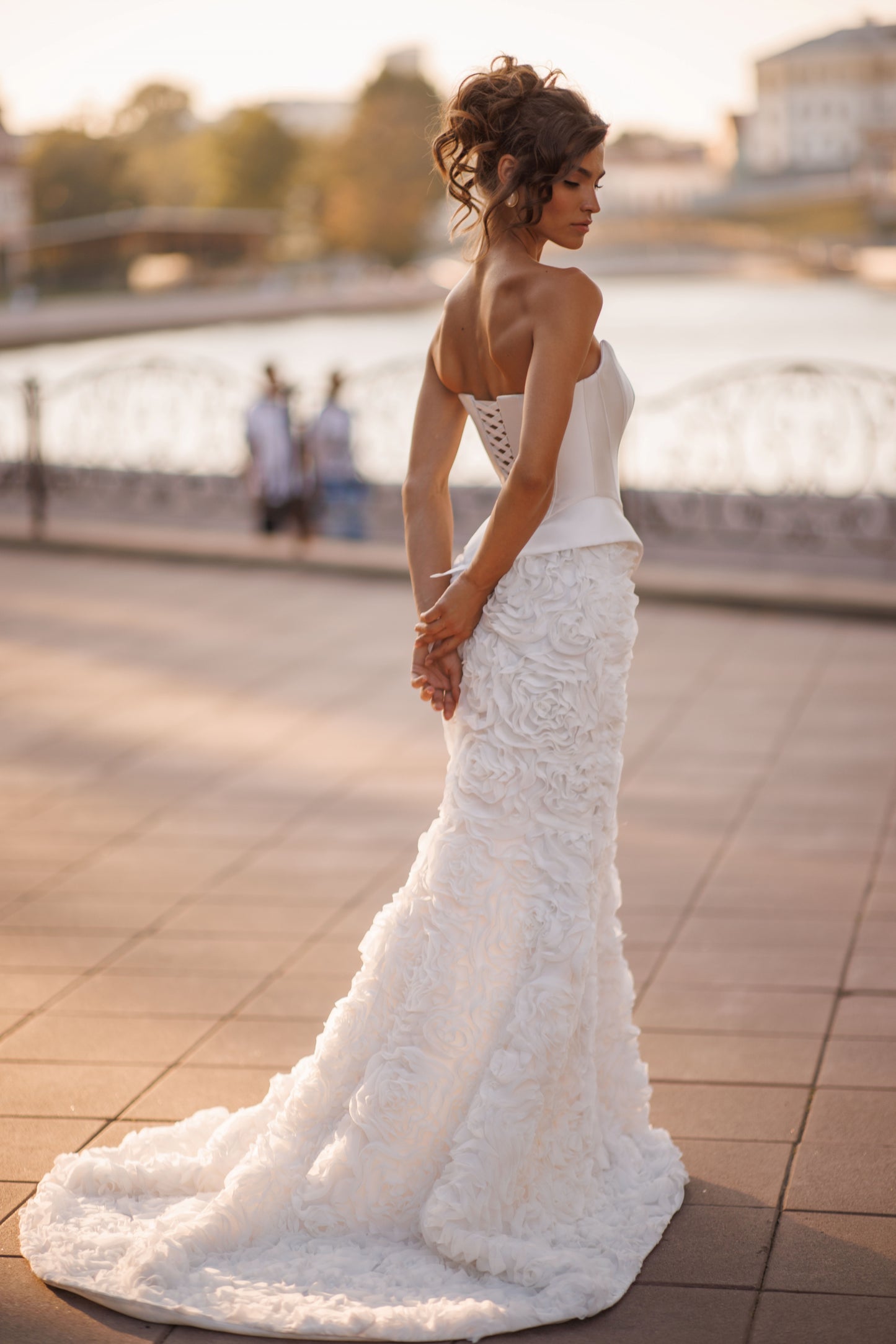 Mermaid wedding dress with boat neckline and ruffled fishtail train