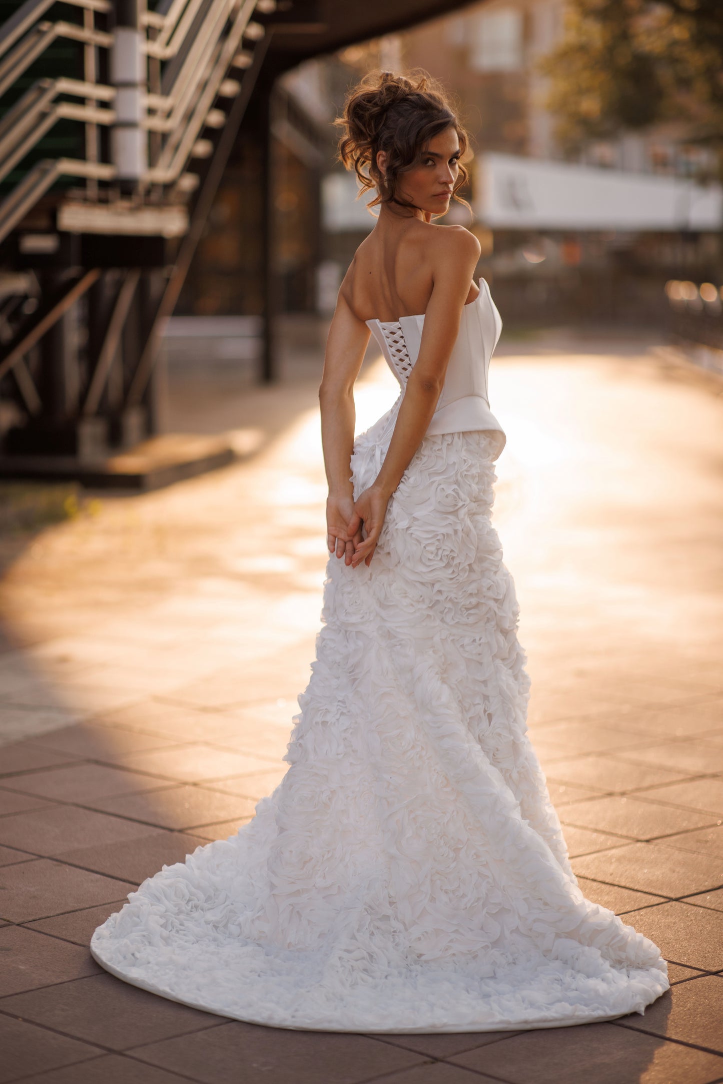 Mermaid wedding dress with boat neckline and ruffled fishtail train