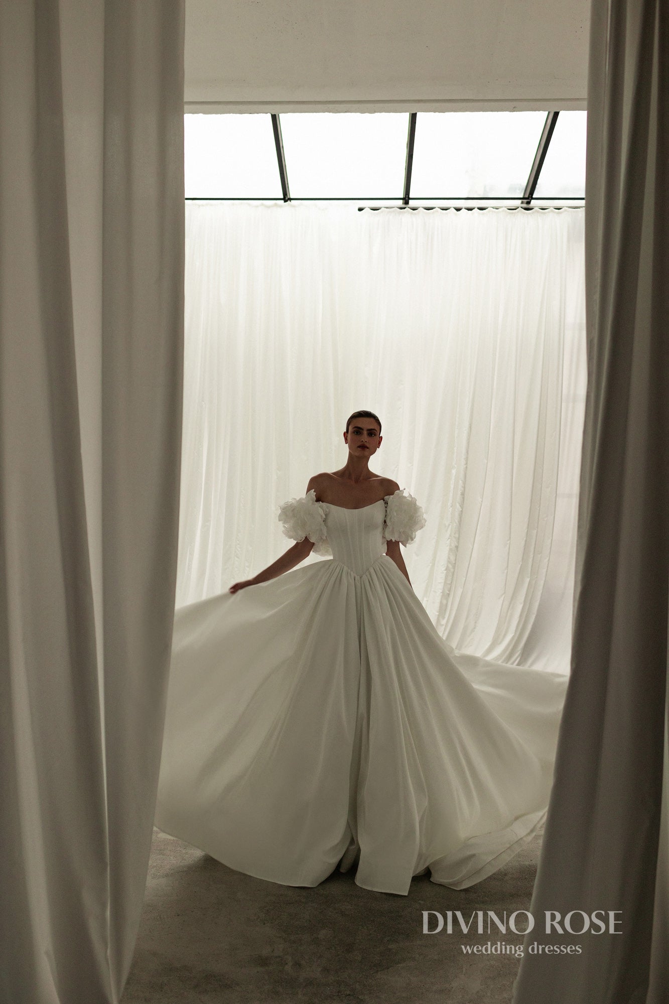 A-line corset wedding dress with boat neckline and sleeves