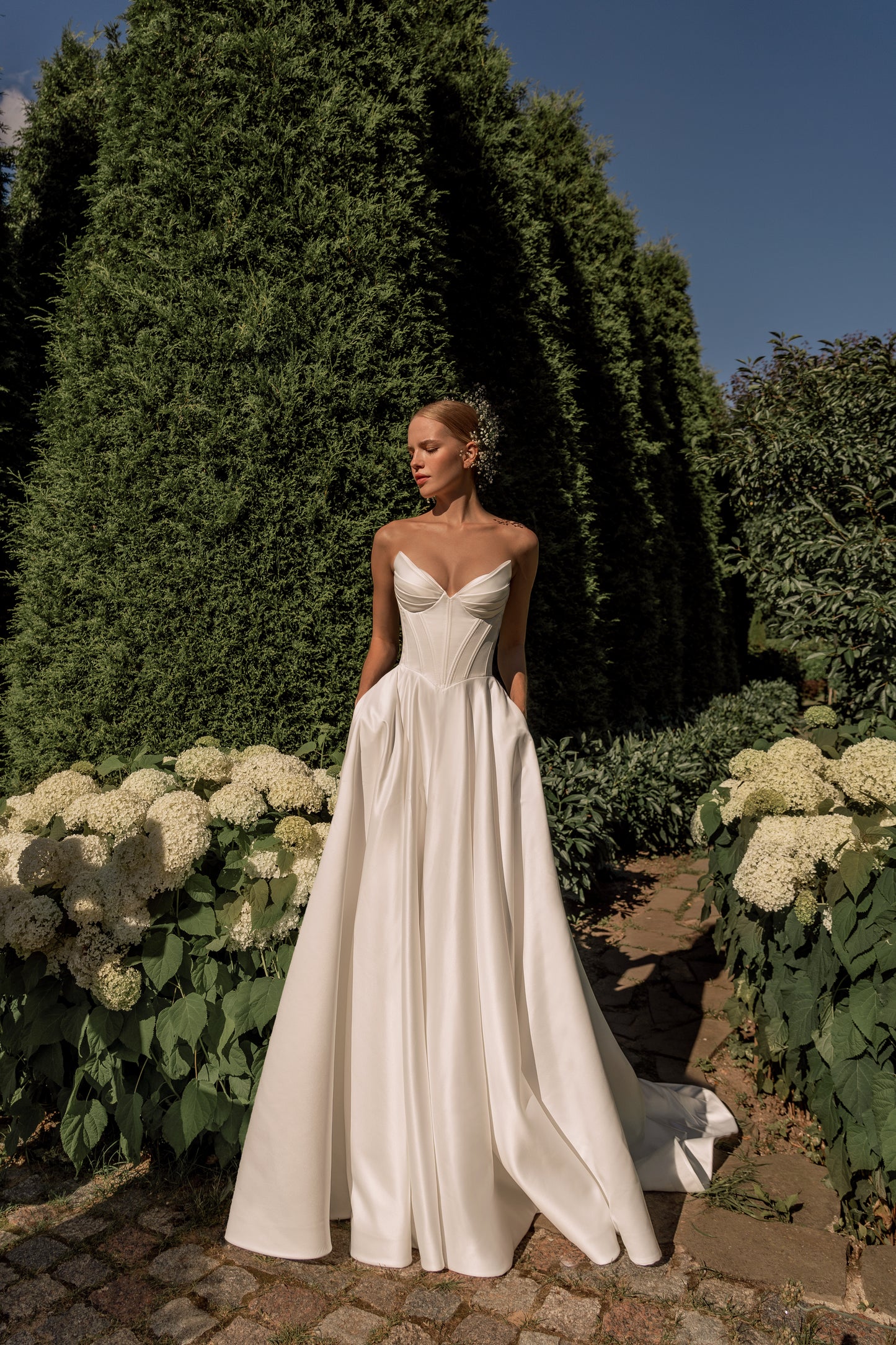 Minimalist satin A-line wedding dress with drop waist corset