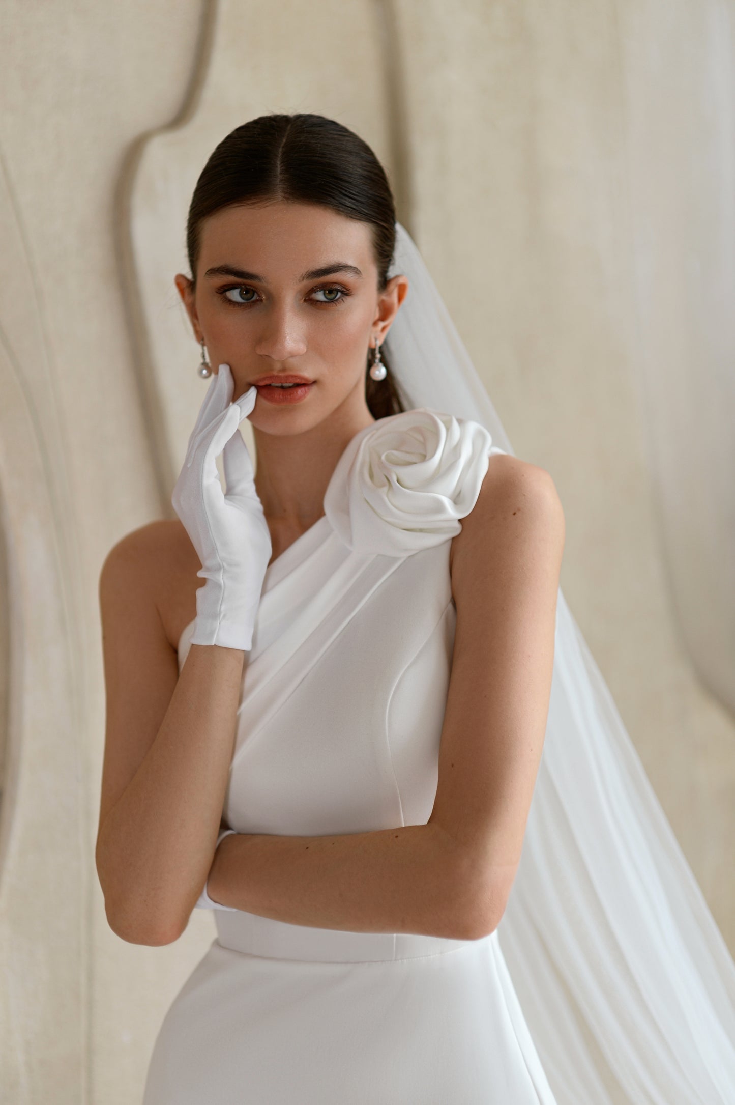 Fitted satin mermaid wedding dress with slit & floral detail.