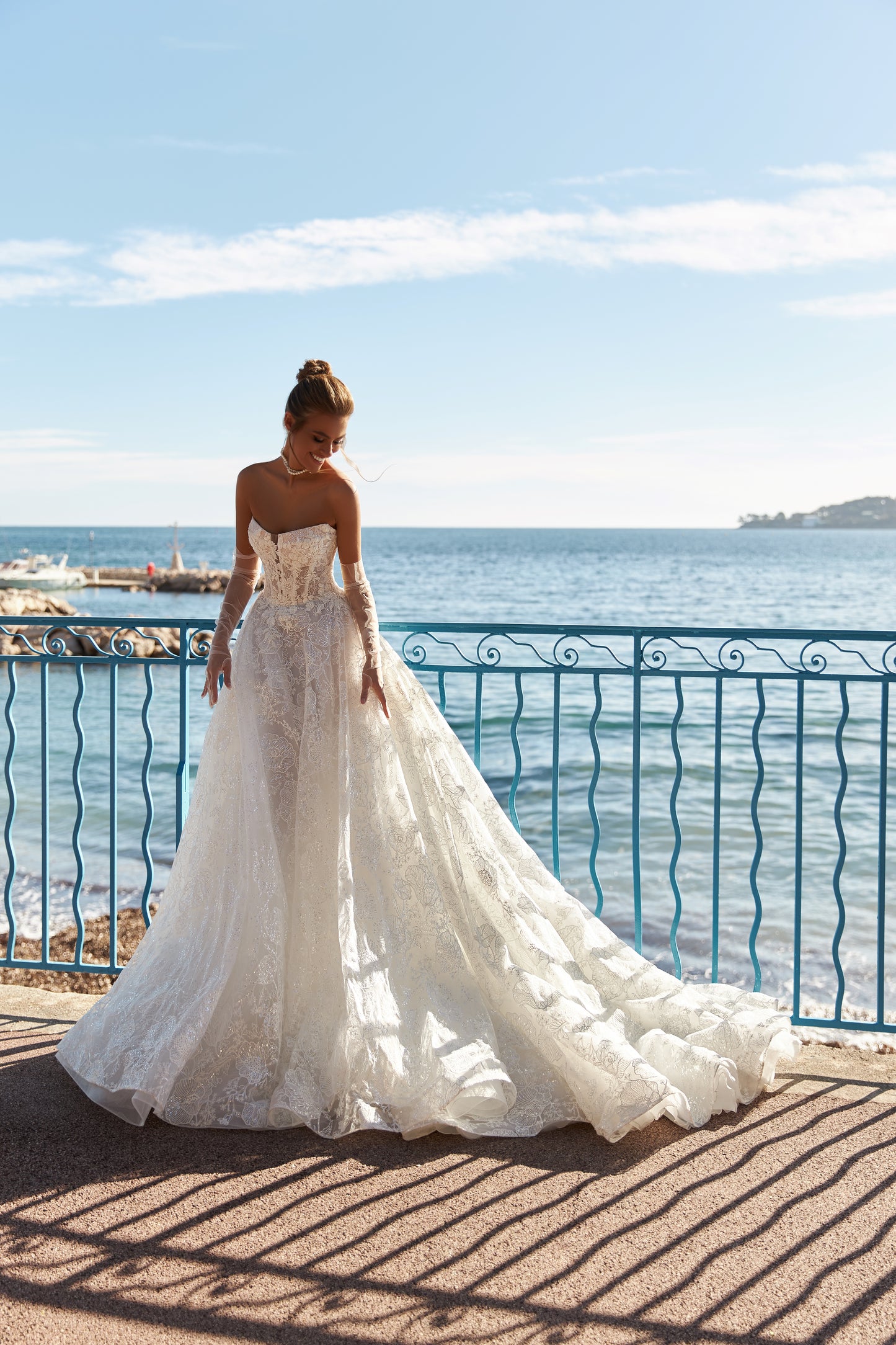 A-line lace wedding dress with chapel train & deep-V neckline.