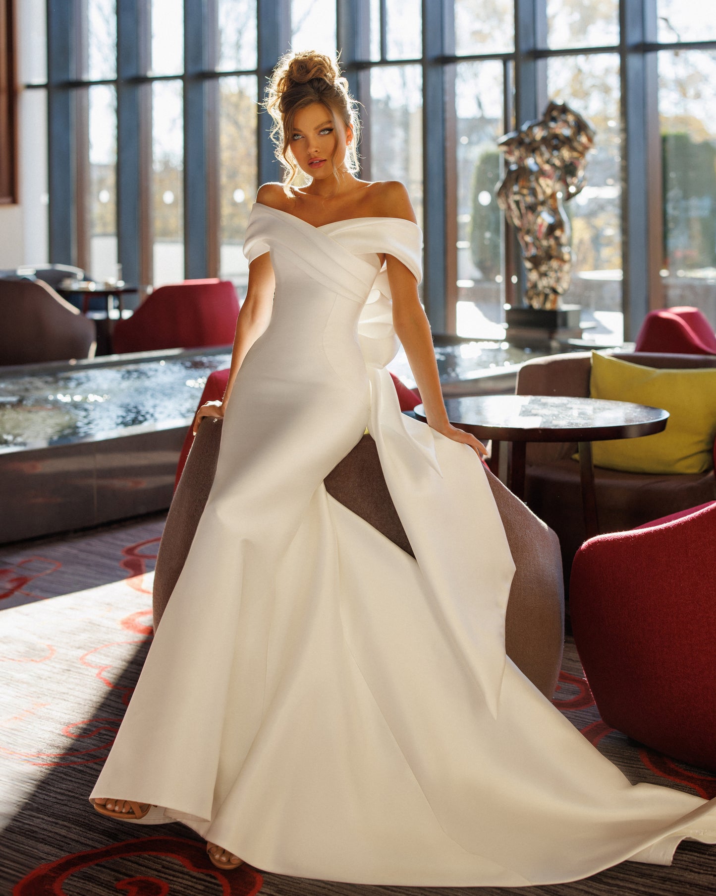 Mermaid Mikado wedding dress with fishtail train and bow.