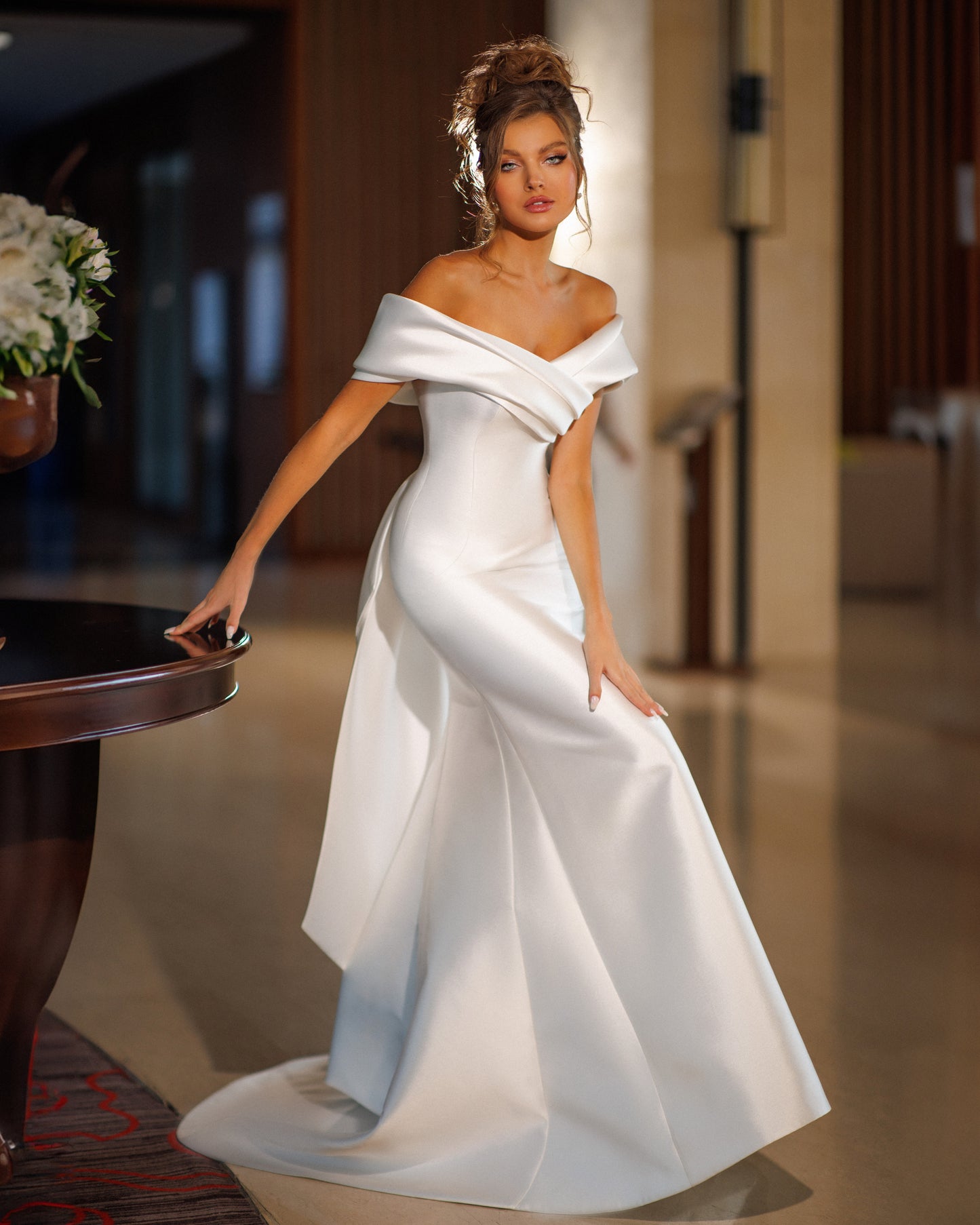 Mermaid Mikado wedding dress with fishtail train and bow.