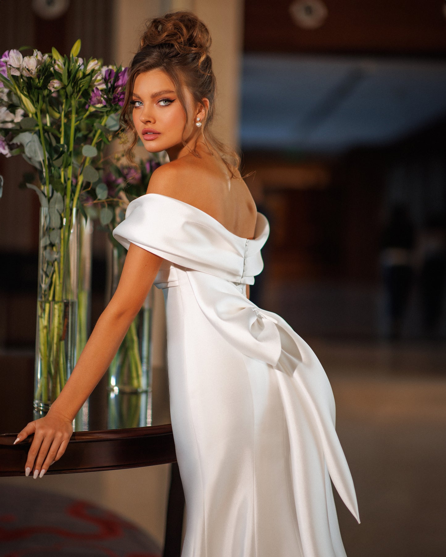 Mermaid Mikado wedding dress with fishtail train and bow.