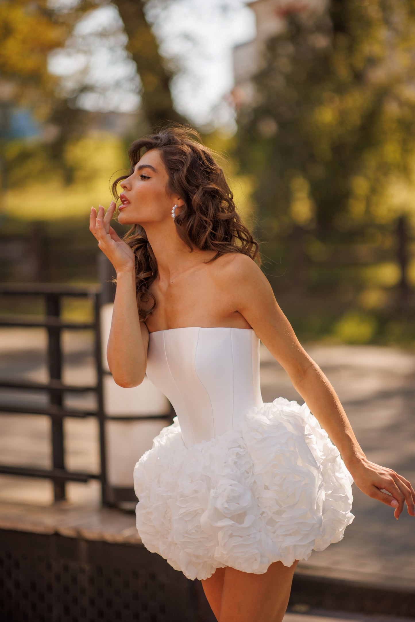 Mini above-knee wedding dress with ruffle skirt and lace-up back