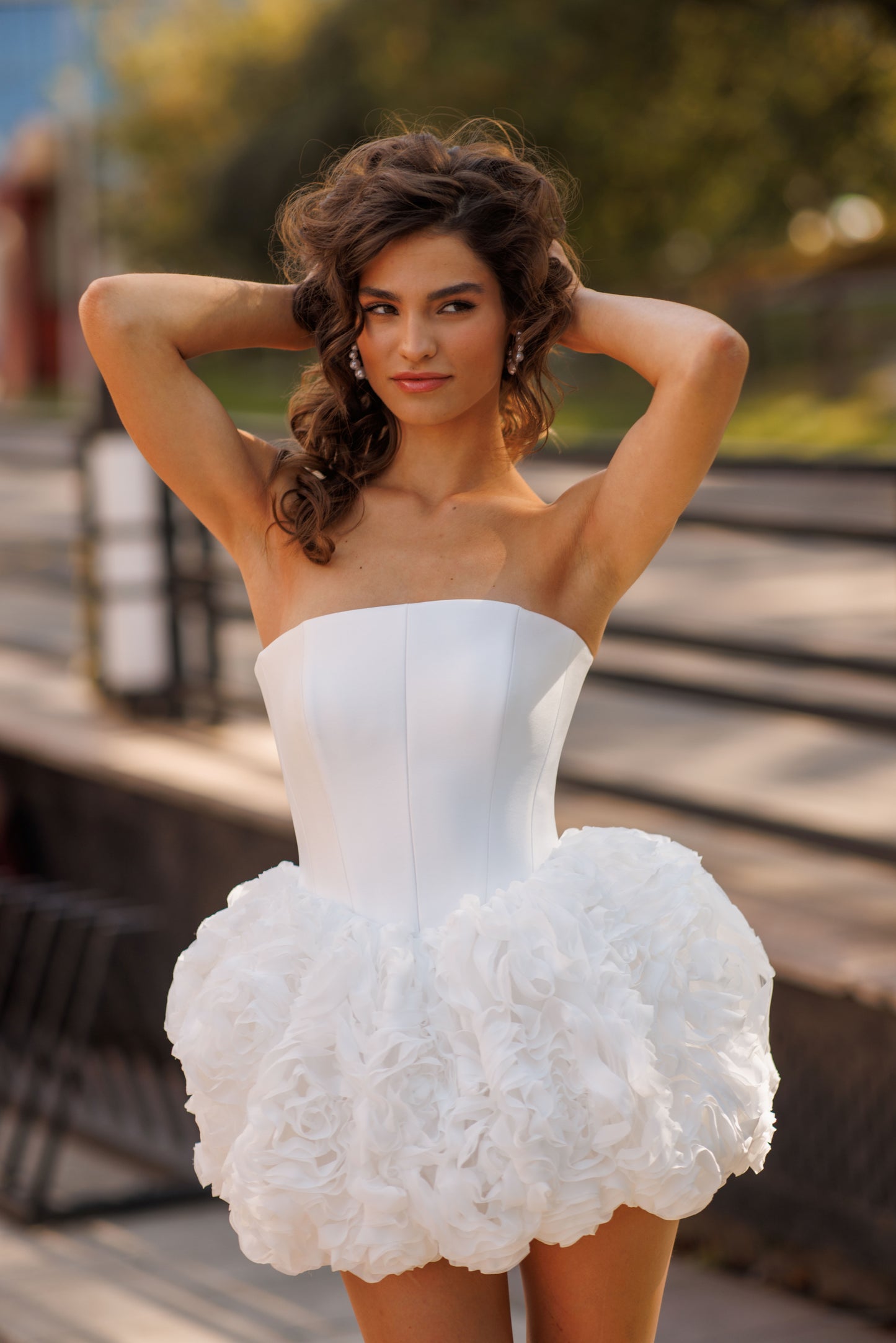 Mini above-knee wedding dress with ruffle skirt and lace-up back