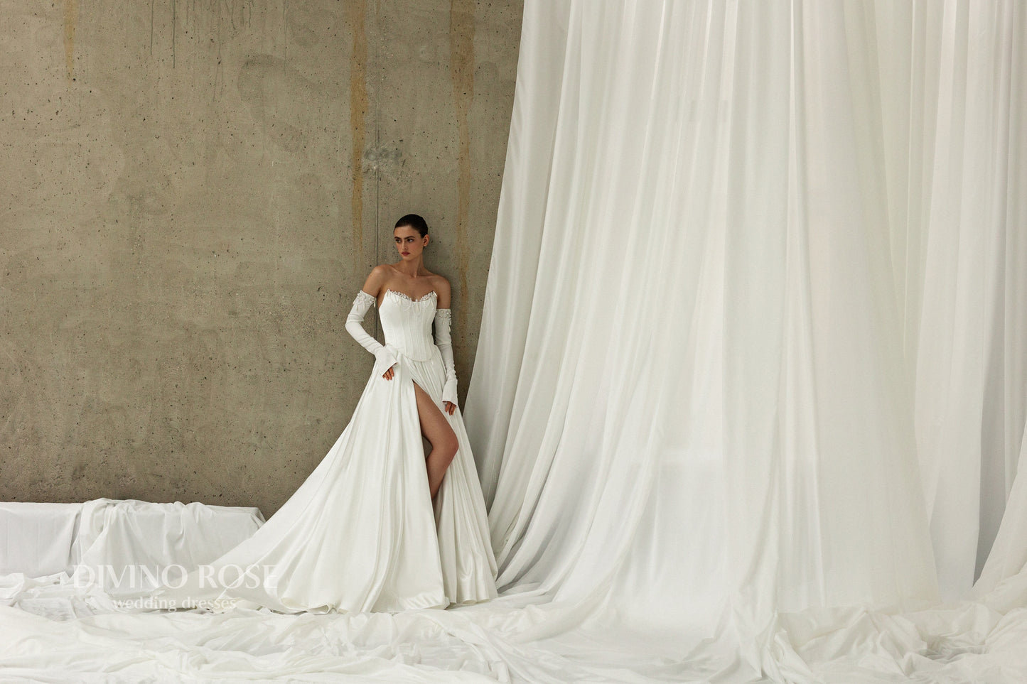 Elegant wedding dress with chapel train, corset, and boat neckline.