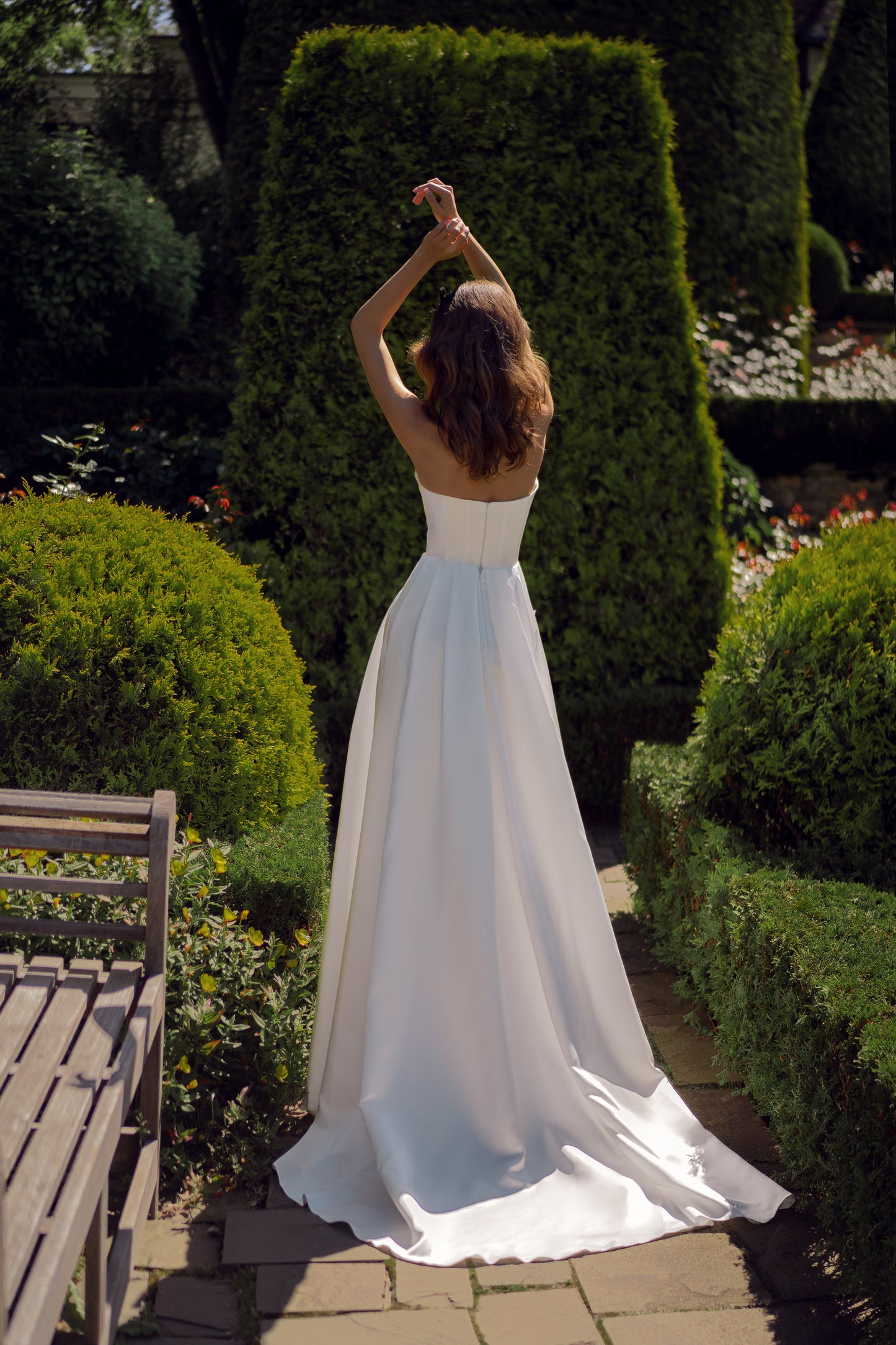 Sleeveless wedding dress with draped V-neckline & 3D details