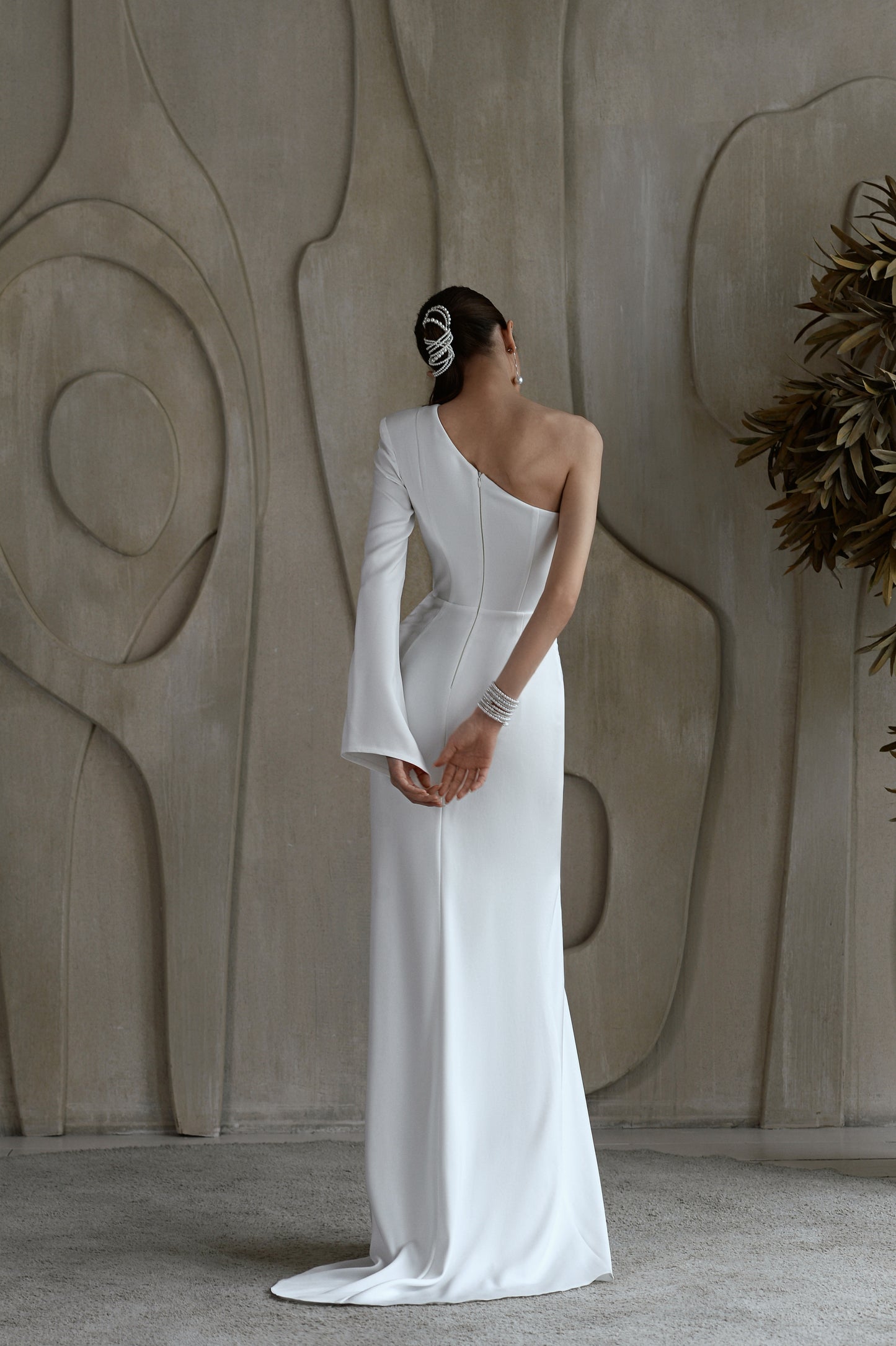 Modern fitted column wedding dress with slit skirt and one shoulder