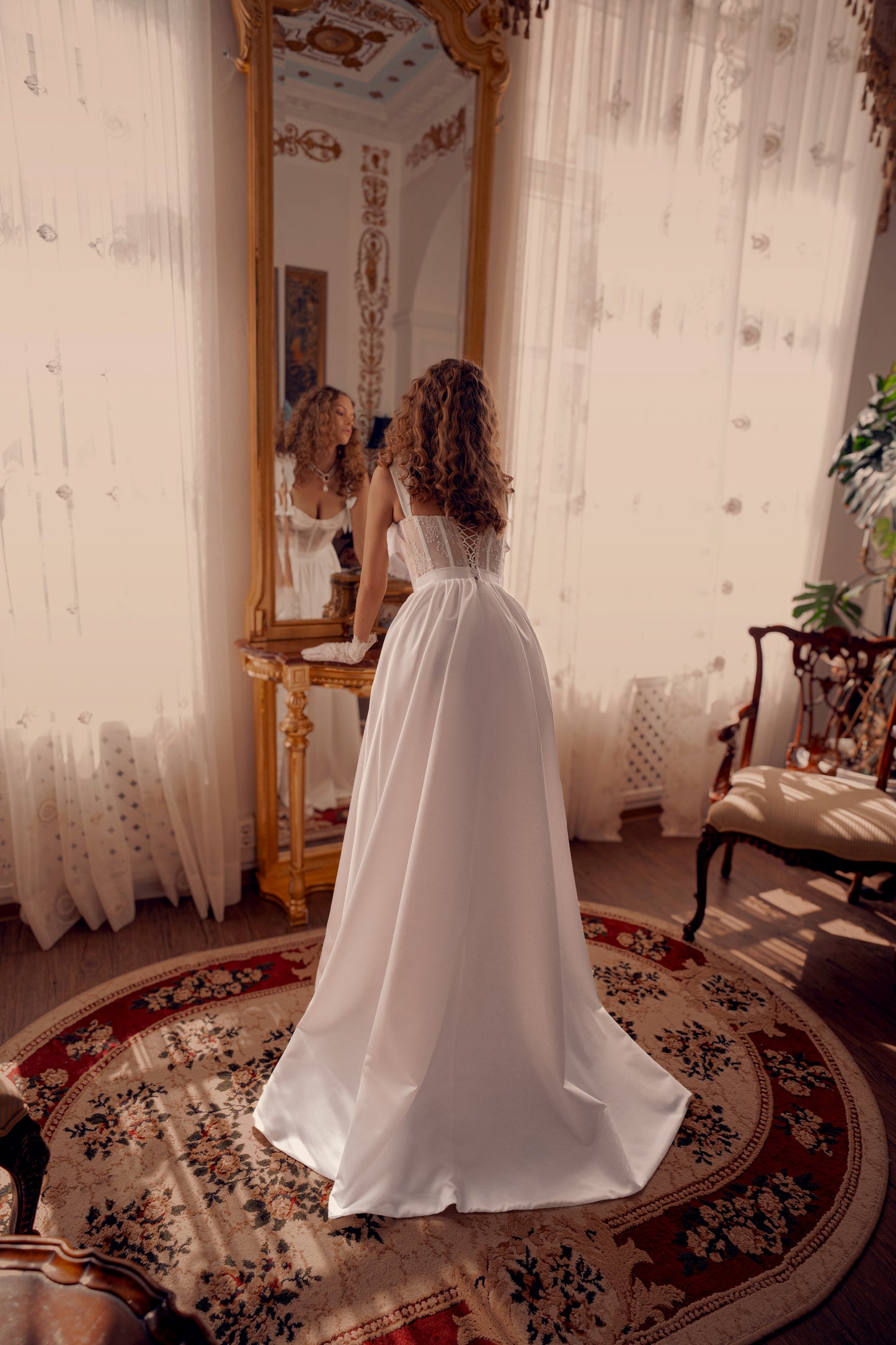 corset lace wedding dress with satin overskirt, bow straps and high slit