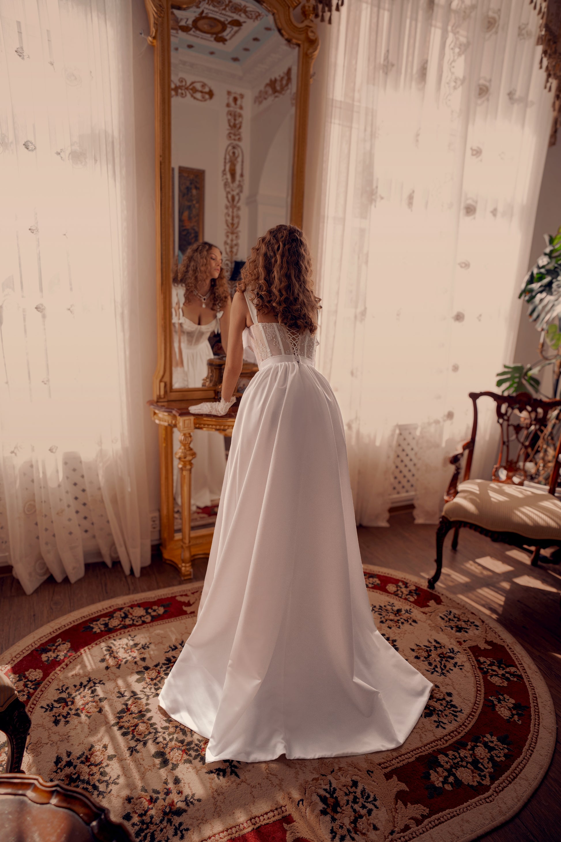 corset lace wedding dress with satin overskirt, bow straps and high slit