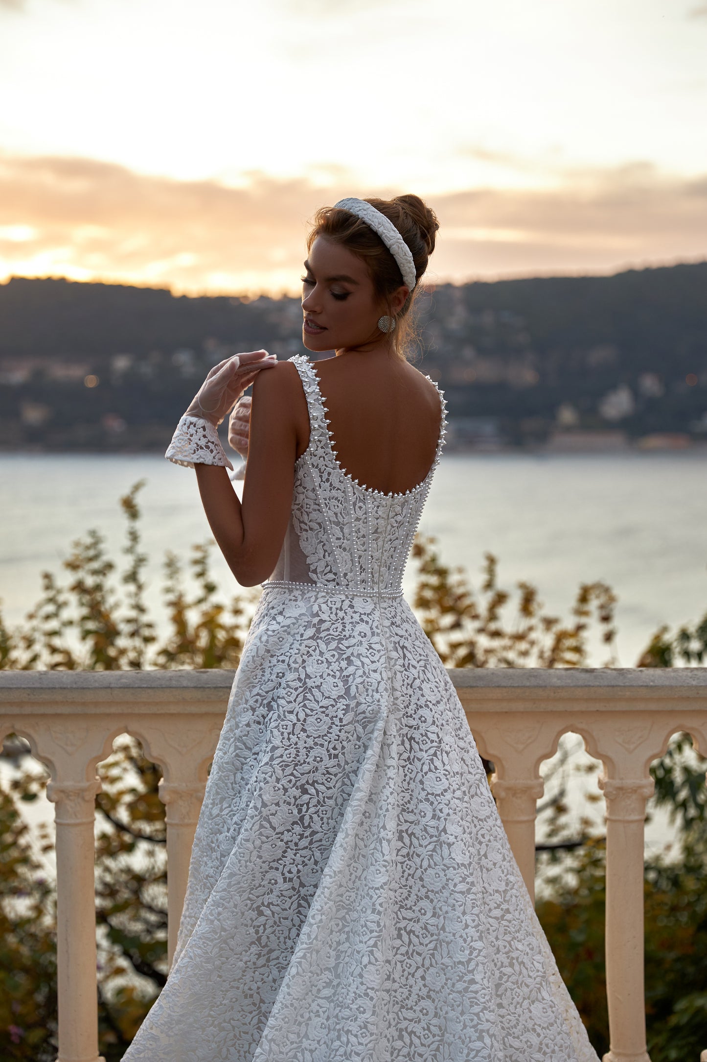 A-line ivory wedding dress with lace and halter neckline.