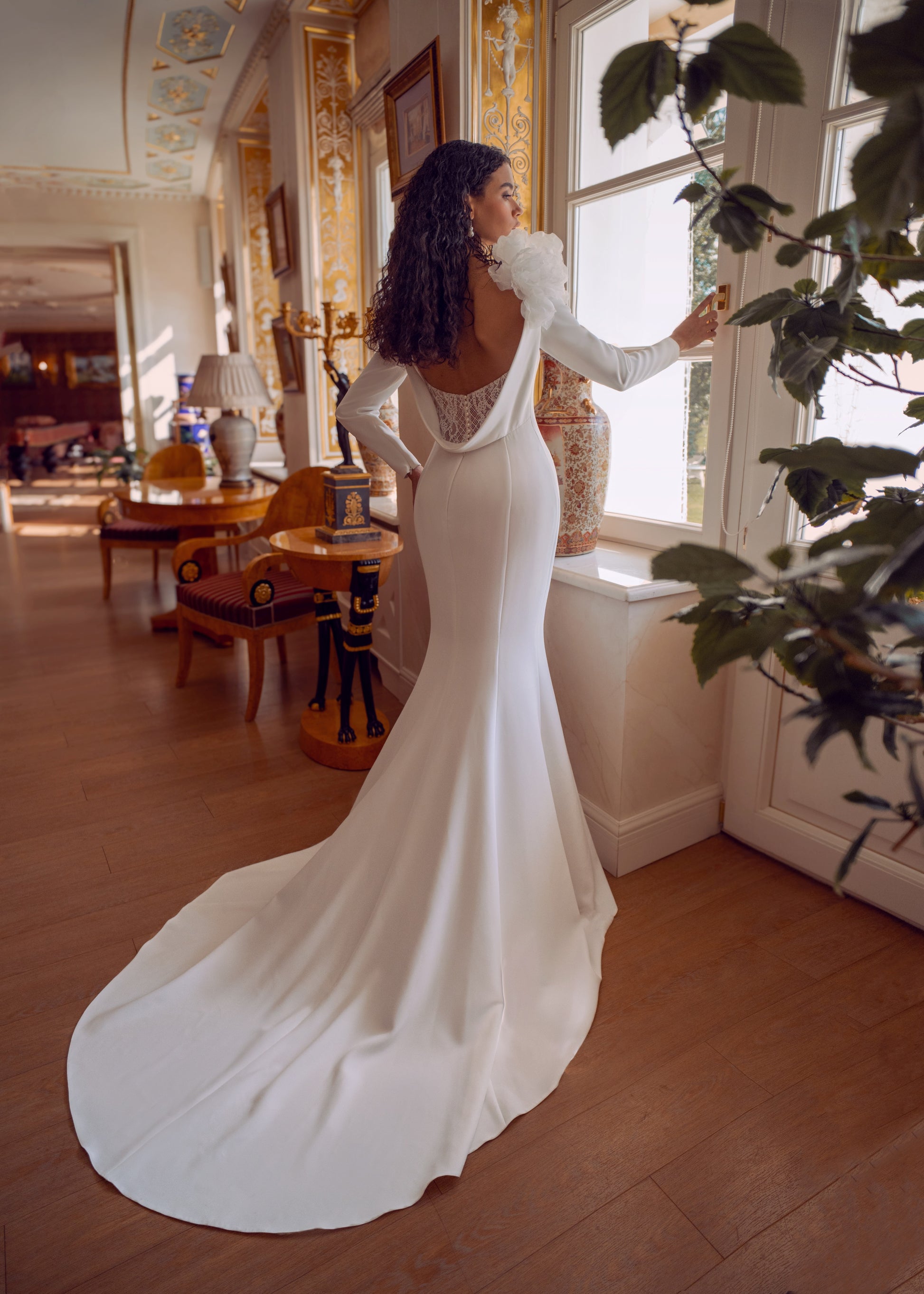 long sleeve crepe wedding dress with floral shoulder and open lace back
