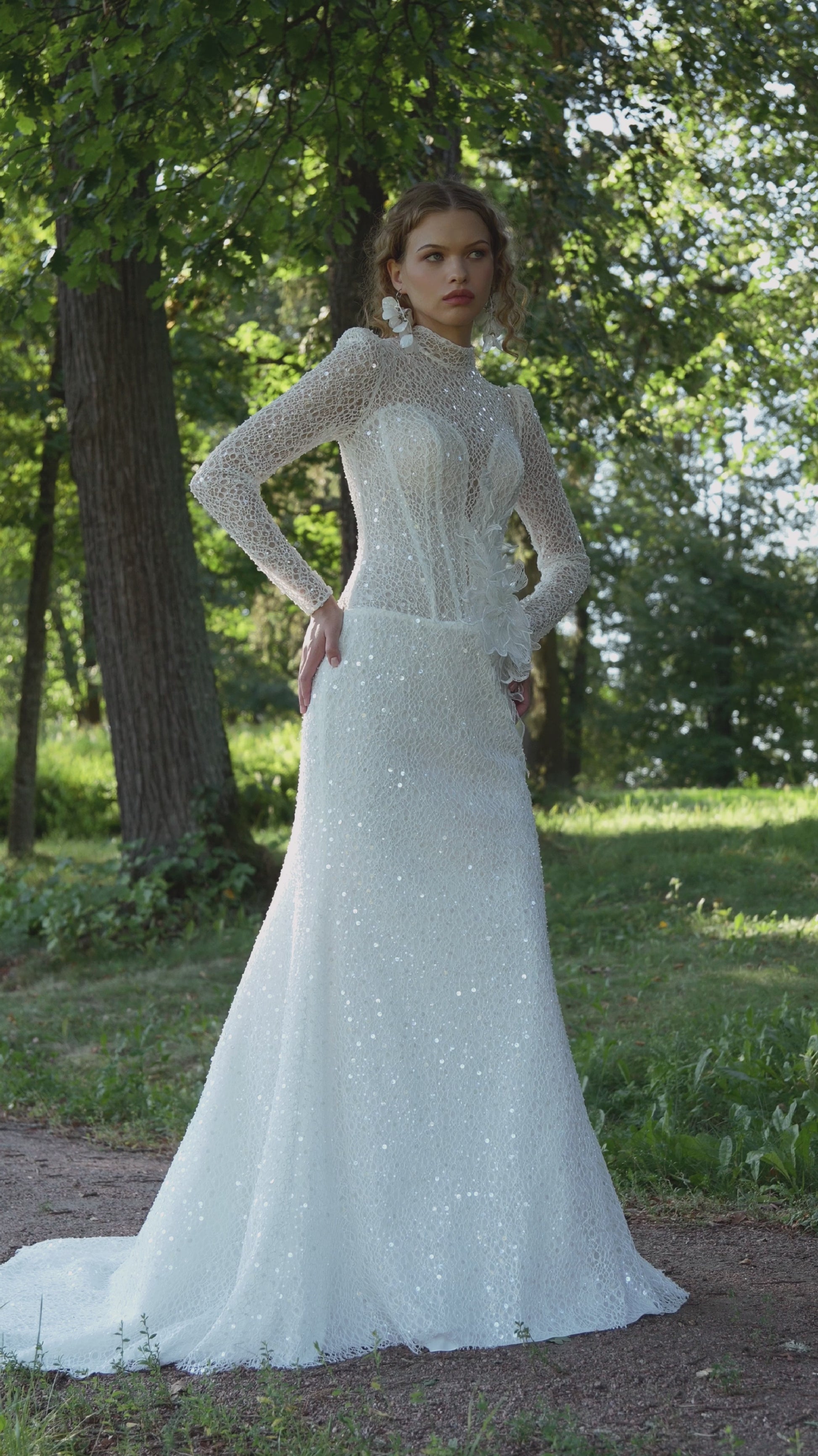 long sleeve lace mermaid wedding dress with high neckline, beaded illusion bodice and floral waist accent