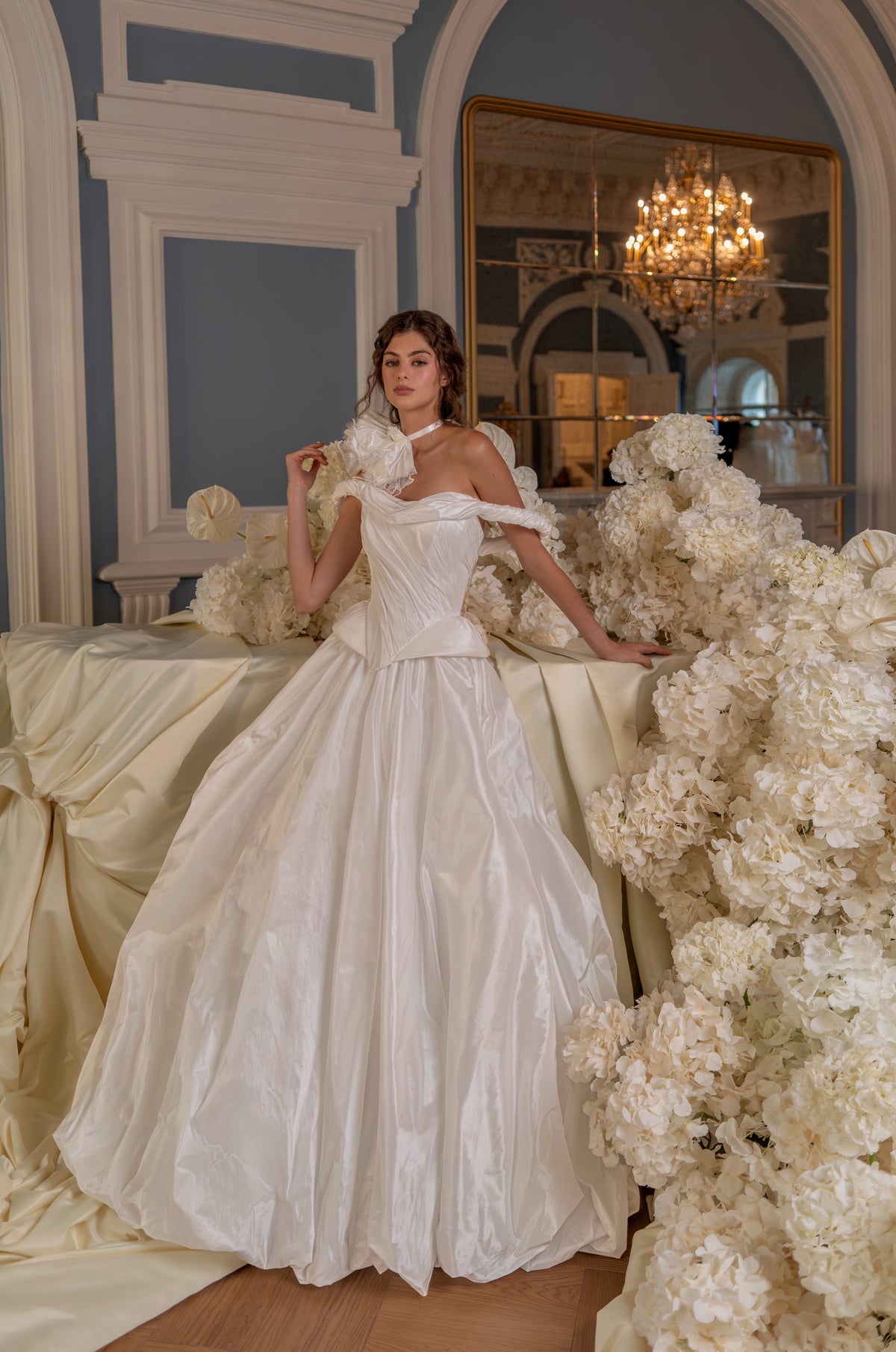 Taffeta ball gown wedding dress with off-shoulder corset – full-length front view among fabric flowers