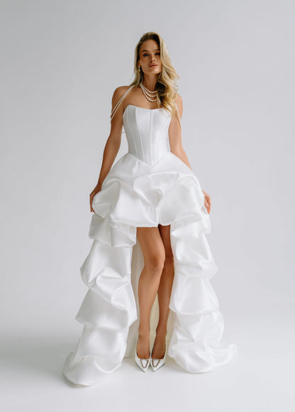 Strapless satin corset dress with a tiered ruffle high-low skirt, front view
