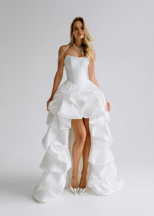 Strapless satin corset dress with a tiered ruffle high-low skirt, front view