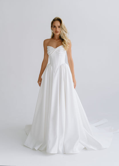 Strapless matte satin A-line wedding dress with a draped sweetheart bodice, front view