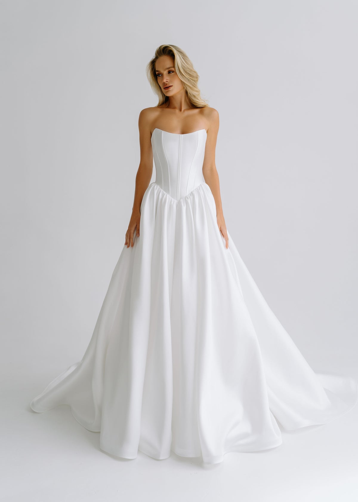 Strapless satin A-line wedding dress with a straight-neckline corset, front view