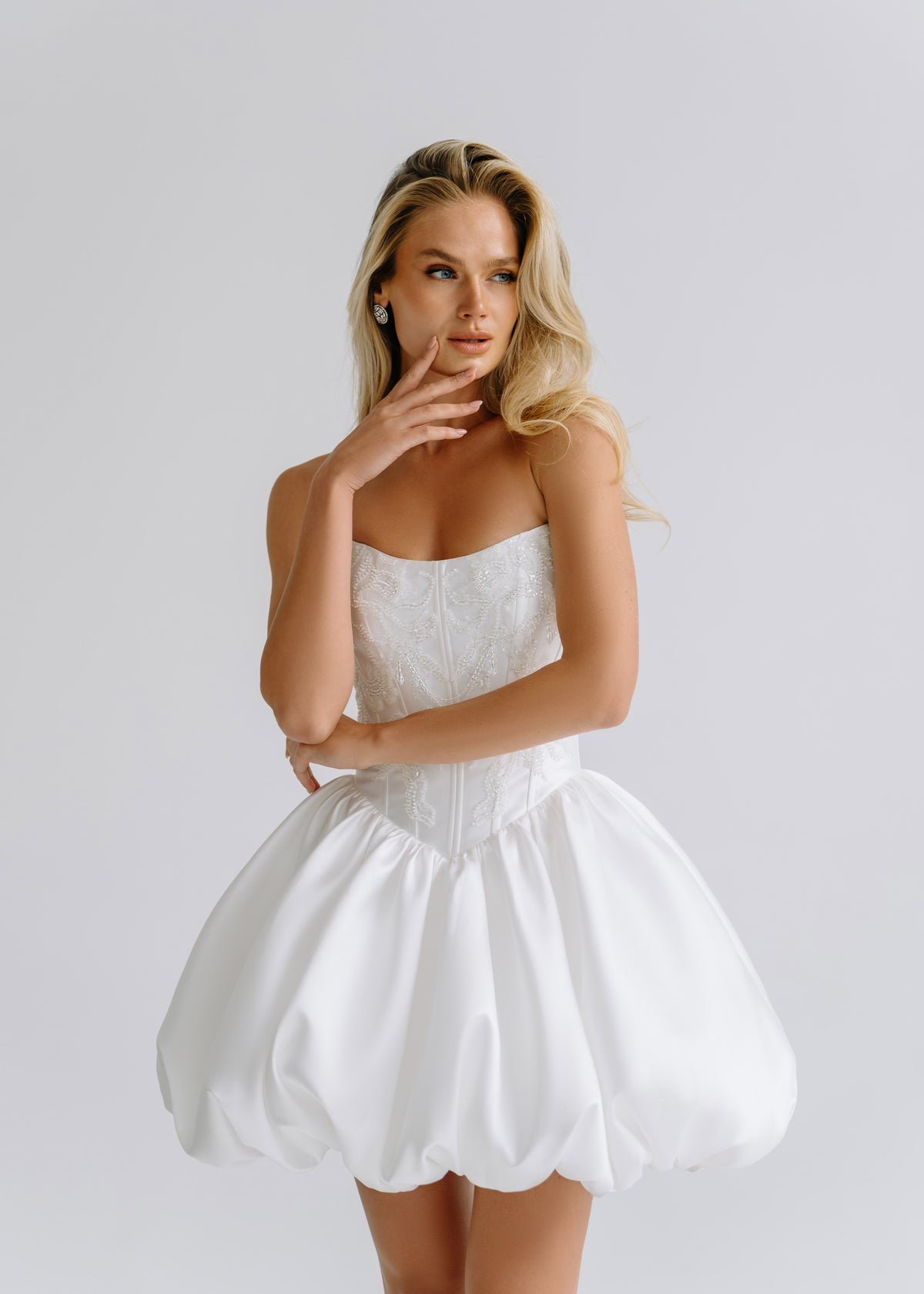 Short satin bubble-hem dress with a strapless beaded corset