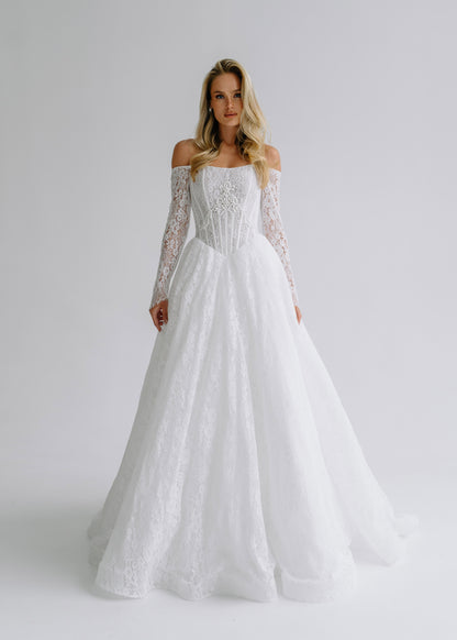 Lace A-line wedding dress with an off-shoulder neckline and long lace sleeves, front view