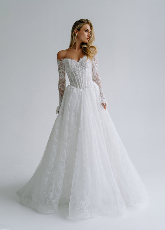 Lace A-line wedding dress with an off-shoulder corset and long lace sleeves, front view