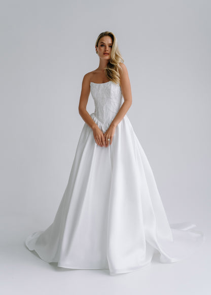 Strapless satin A-line wedding dress with an embroidered corset bodice, front view