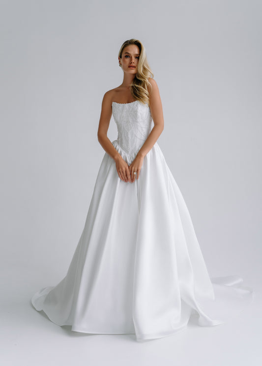Strapless satin A-line wedding dress with an embroidered corset bodice, front view