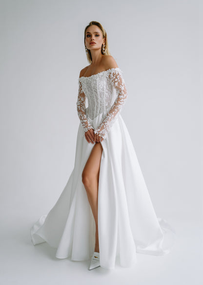 Satin A-line wedding dress with an off-shoulder lace corset, long lace sleeves and a high slit, front view