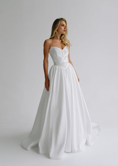 Strapless satin A-line wedding dress with an embroidered sweetheart bodice, front view