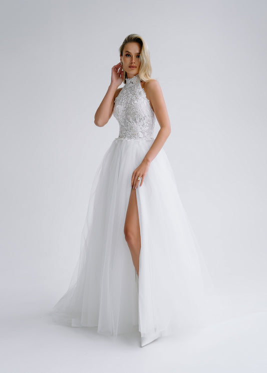 Tulle wedding dress with a halter beaded lace bodice and a high slit, front view