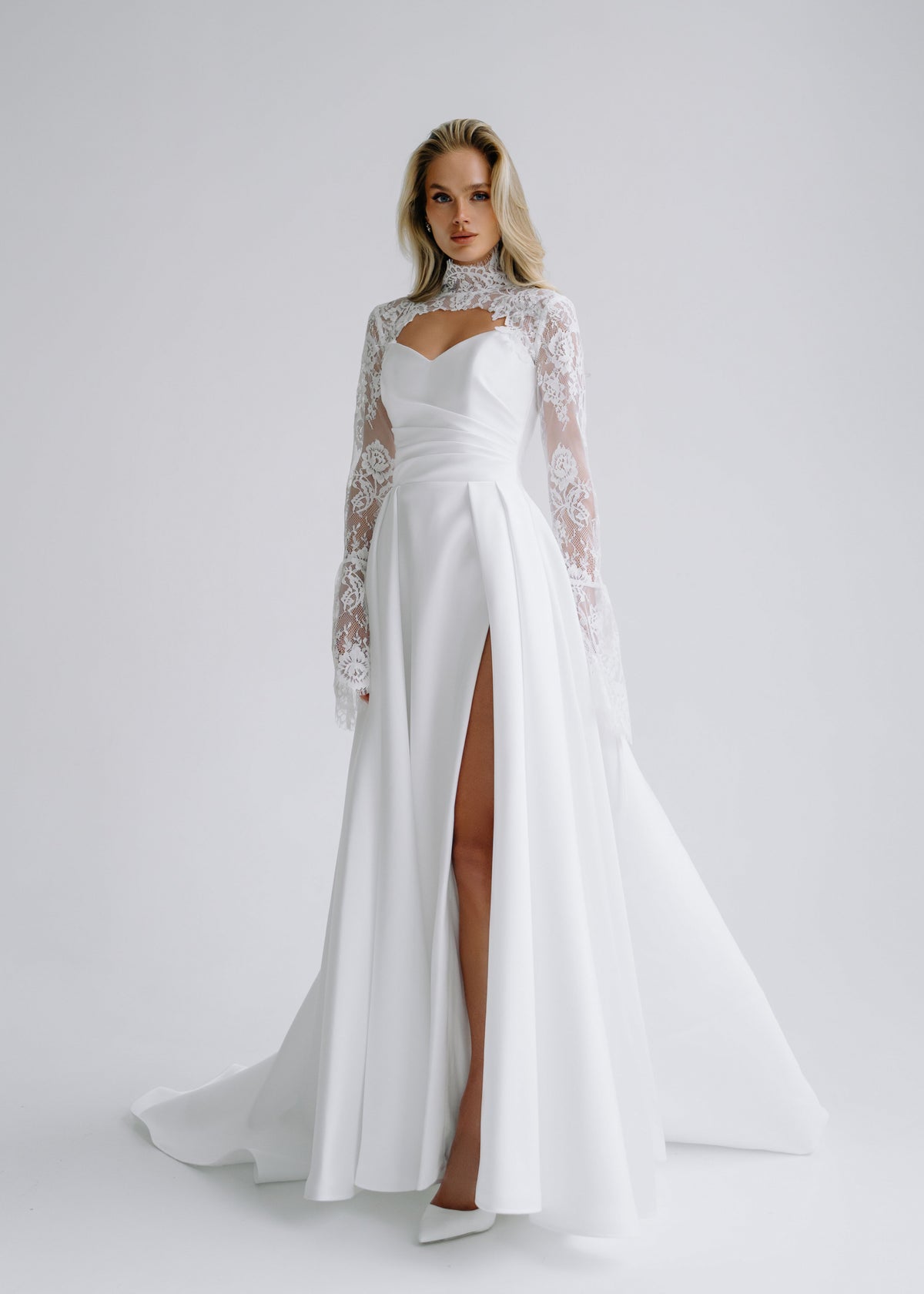 Satin A-line wedding dress with a high slit and a lace high-collar bolero, front view