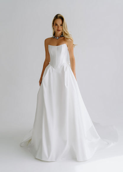 Strapless satin A-line wedding dress with a structured corset bodice, front view