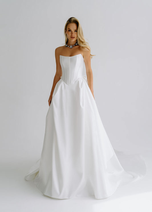 Strapless satin A-line wedding dress with a structured corset bodice, front view