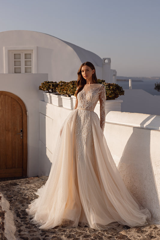 Fit and flare mermaid wedding dress with lace and long sleeves