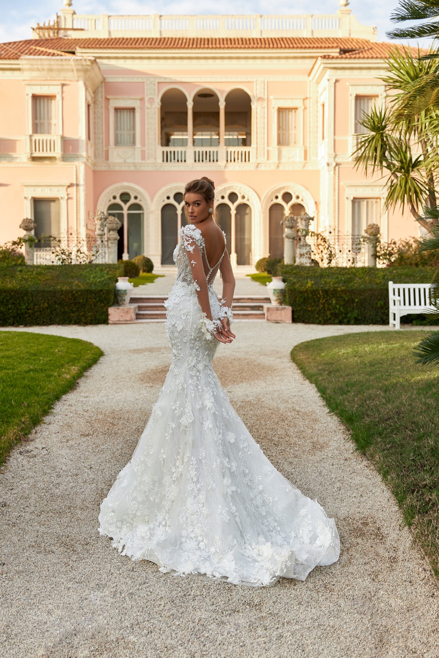 Fitted Mermaid wedding gown with illusion long sleeves, V-neckline, open V-shaped back, lace appliques, 3D flowers, bead and sequin embroidery, detachable chapel train overskirt, Chantilly lace.