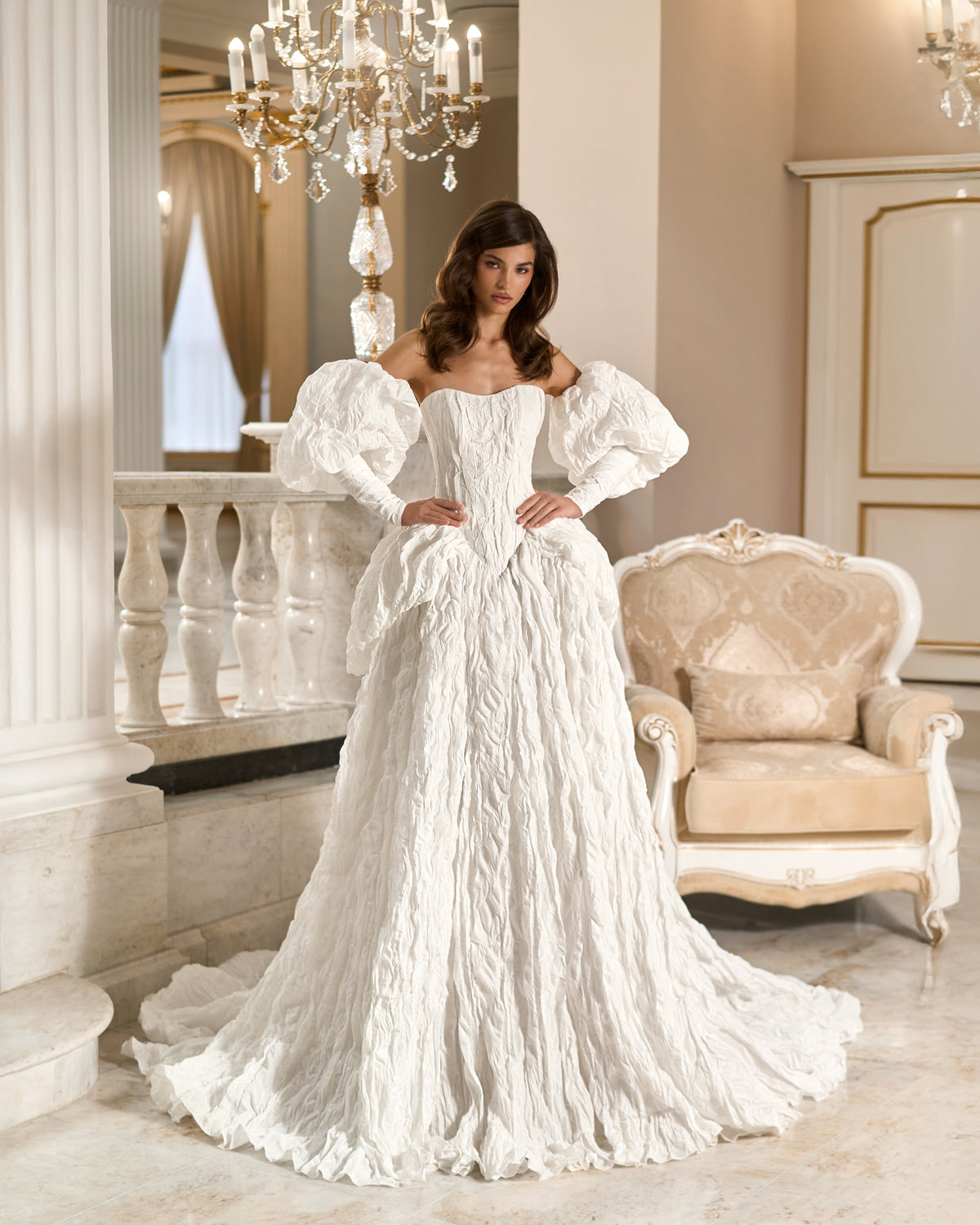Front view of a white textured taffeta ball gown wedding dress with a basque waist, sweetheart bodice, long puff sleeves and full skirt.