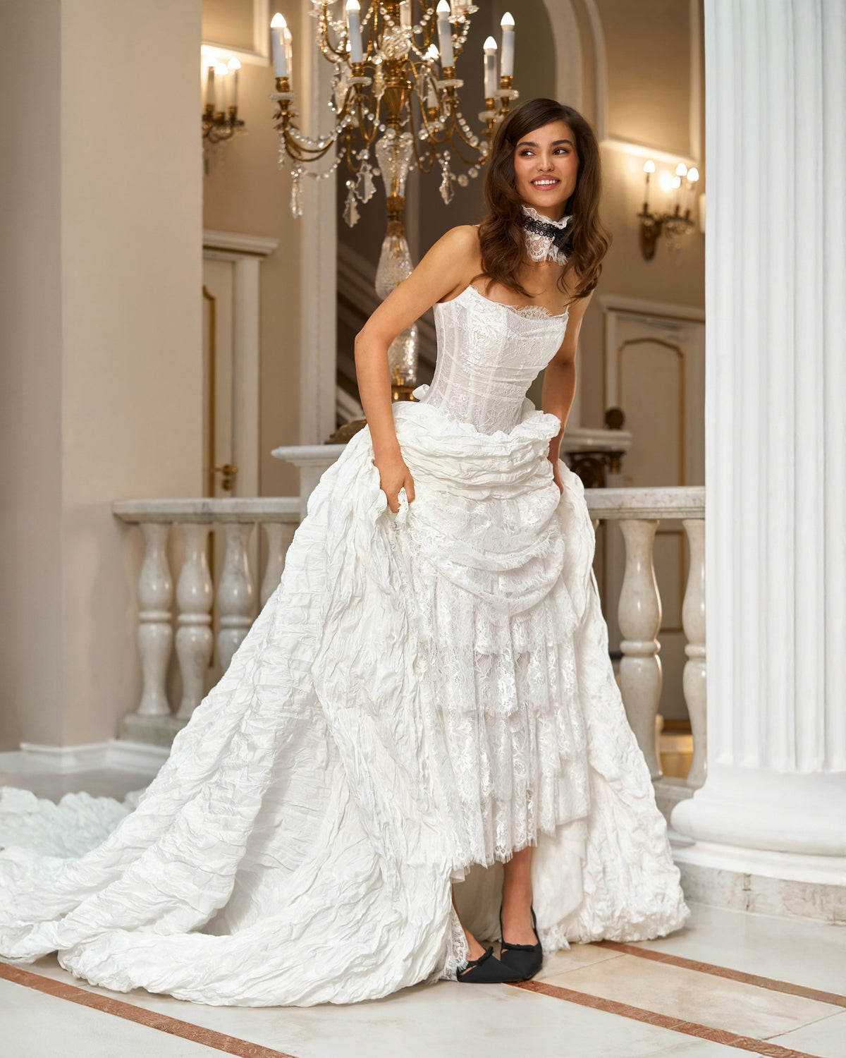 Full-length front view of the high-low taffeta and lace wedding dress without sleeves, styled with a lace choker.