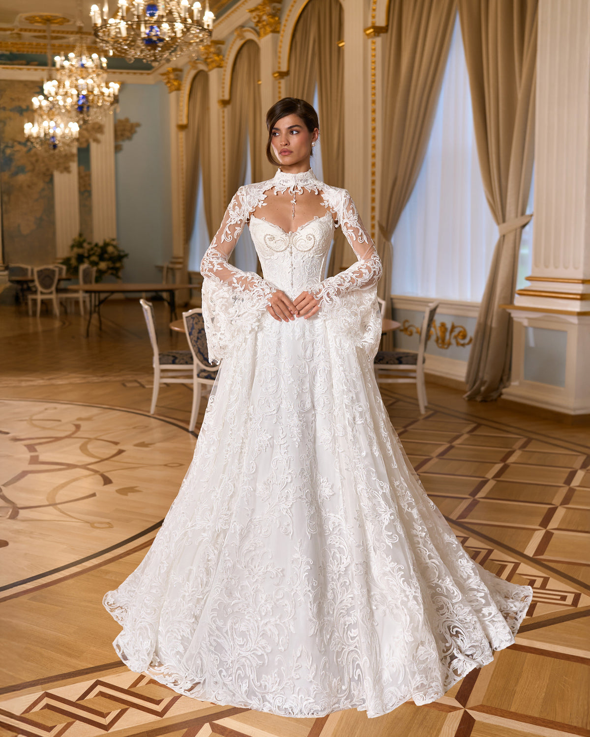 A-line lace wedding dress with pearl corset bodice, high-collar lace bolero and long bell sleeves