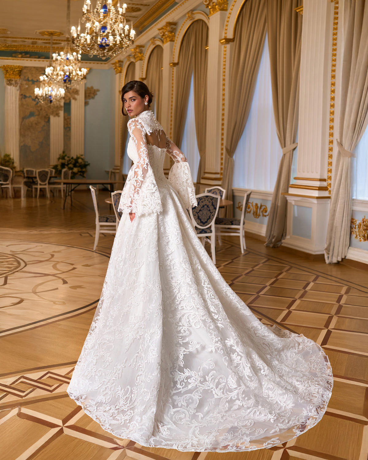 Back view of A-line lace ball gown with chapel train and lace bolero with keyhole back