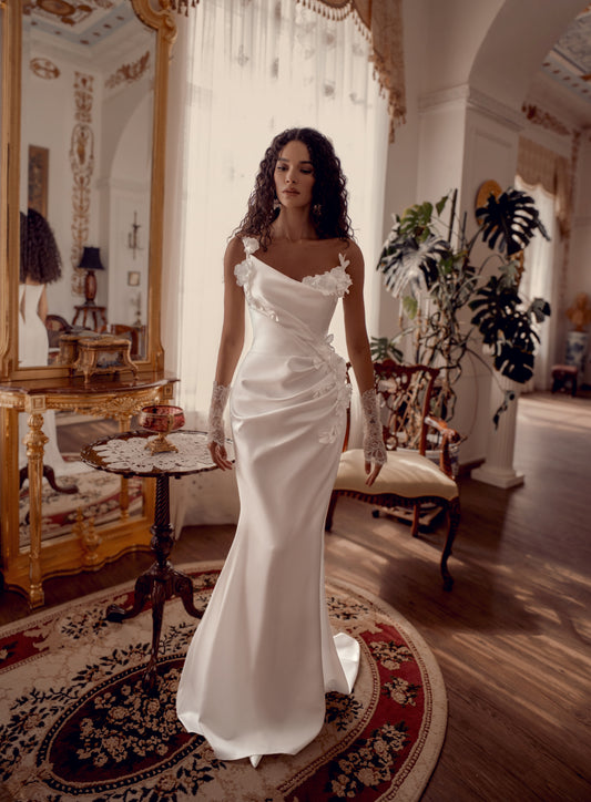 Silk satin wedding gown with asymmetric draped neckline and 3D floral appliqué.