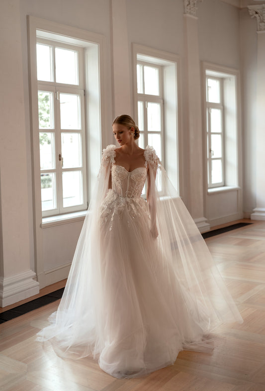 Romantic wedding dress with 3D straps, sweetheart neckline, and pleated tulle bodice.