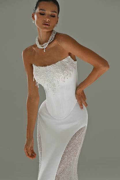 Satin mermaid wedding dress with lace side panels – three-quarter front view with pearl necklace