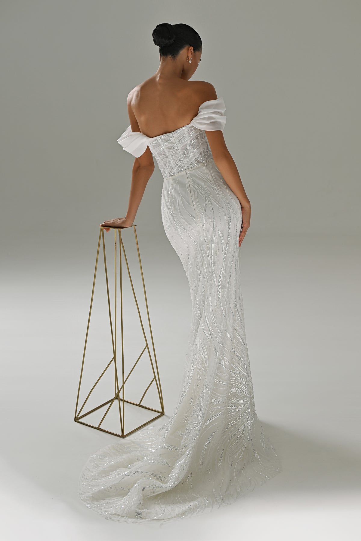 Lace mermaid wedding dress with off-shoulder drape – back three-quarter view