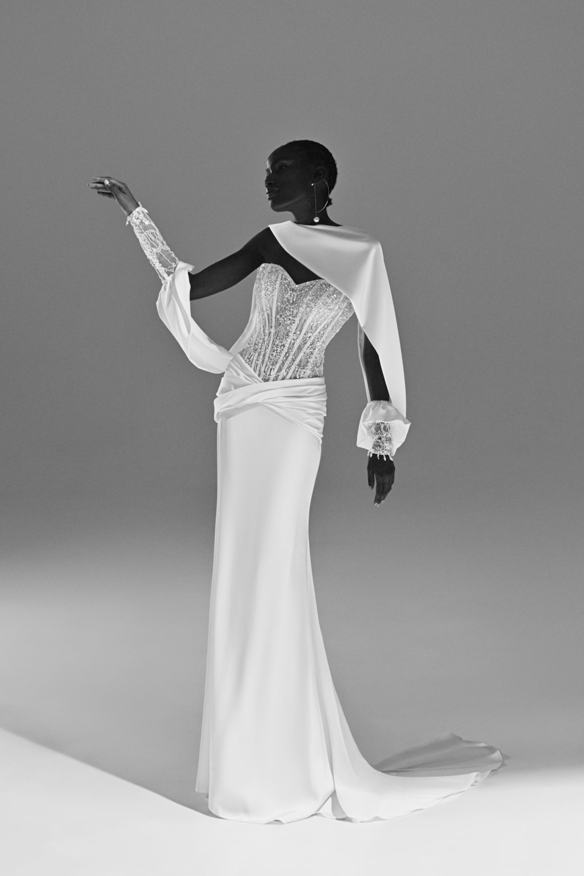 Satin sheath wedding dress – back view of the open back cut-out and sleeve